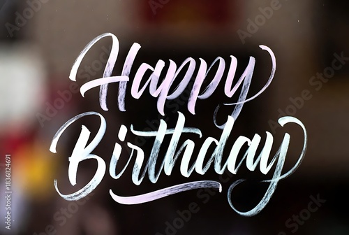 Elegant Happy Birthday Calligraphy on a Blurred Background.