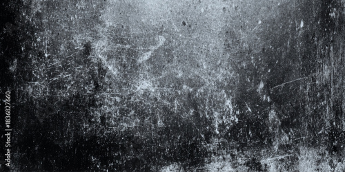 Dark grunge concrete wall texture background with cracks and distressed vintage ominous spooky atmosphere.