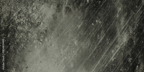 Dark moody grunge texture with scratches cracks and worn concrete surface black and white distressed background.