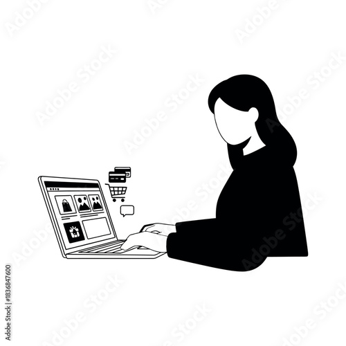 Smiling businesswoman working on a laptop computer at an office desk