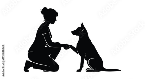 Woman and dog sharing a handshake in silhouette, symbolizing trust and companionship.
