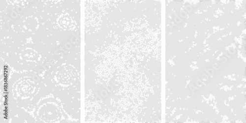 Pale gray distressed background with three panels and textural variations