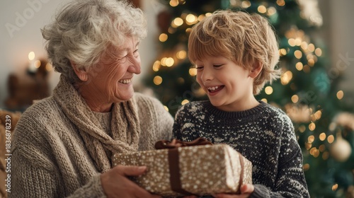A warm, commercial-style scene of a grandson presenting a wrapped gift to his smiling grandmother.