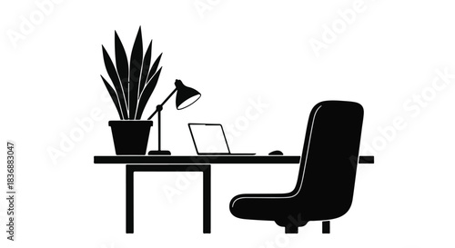 Minimalist workspace with laptop and desk plant for focused work.