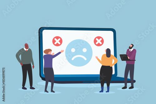 Team discussing negative feedback and customer dissatisfaction displayed on a laptop screen