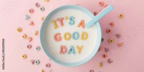Overhead view of colorful letter cereal spelling its a good day in a bowl of milk