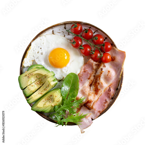 A delicious and nutritious breakfast plate featuring fried egg avocado bacon and cherry tomatoes