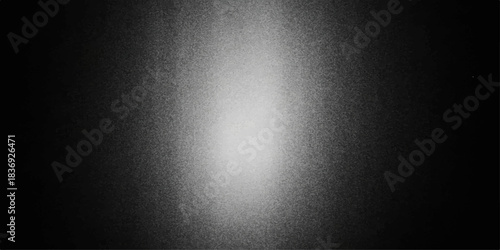 Dark grey brushed metal texture backdrop with a spotlight on the stainless steel surface