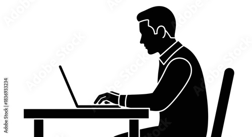 Man working on laptop in modern workspace setting