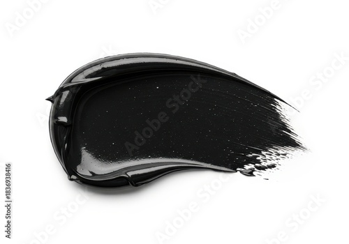 Thick, glossy black cosmetic substance smear applied against a clean white background