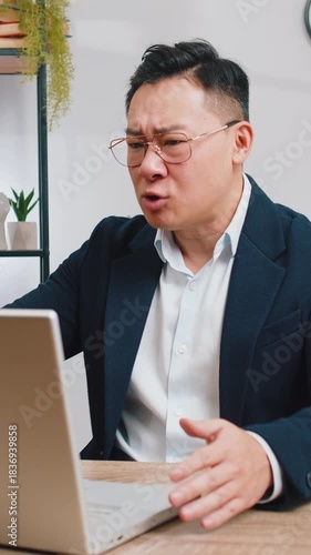 Conflict Quarrel Negotiation. Angry businessman CEO making webcam laptop online video call at office. Upset mad freelancer man talking colleague conversation analyzing financial report mistake problem