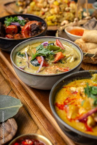 mix of traditional thai curries on restaurant table in phuket thailand
