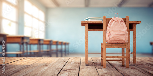 Wooden desk and chair with school backpack on beach deck ocean vacation concept