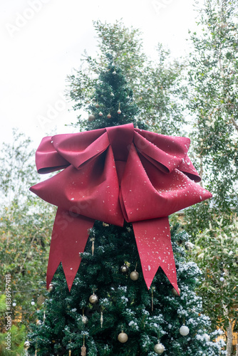 Christmas tree with decoration ornament, with fake snow soap bubbles