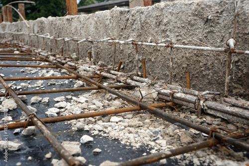 The process of preparing the structure before pouring concrete for the floor or balcony beams.