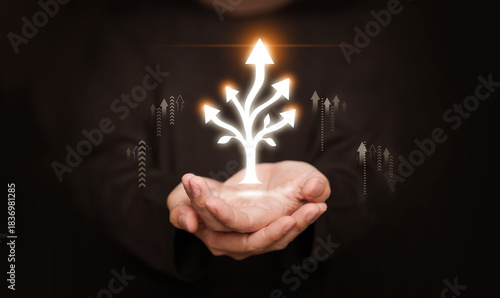 Hands holding glowing branching arrows. Multidimensional growth and progress, expanding opportunities, innovation, sustainability, spiritual path, forward progress in personal and professional fields.