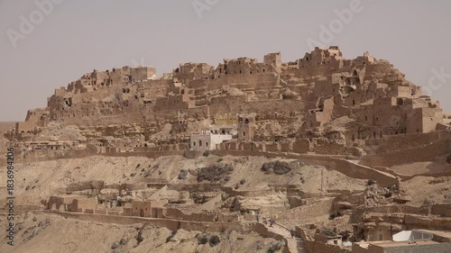 View of traditional Berber village of Takrouna, a former fortified granary known for its troglodyte housing style, in Tunisia
