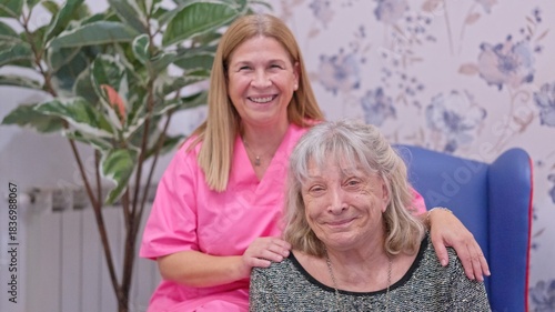 Caregiver woman providing support to elderly lady