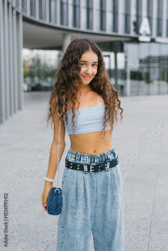 Stylish Girl Smiling Confidently Outdoors