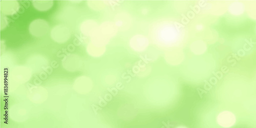Bright green bokeh abstract background with soft sunlight and blurred nature effects