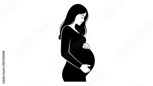 Pregnant woman gently cradling her baby bump in a serene moment.