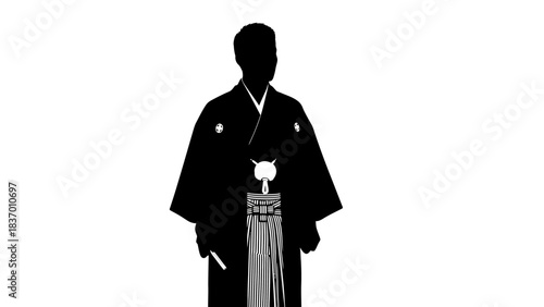 Silhouette of a man in traditional Japanese formal wear.
