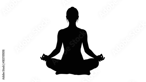 Silhouette of a person meditating in a lotus position.