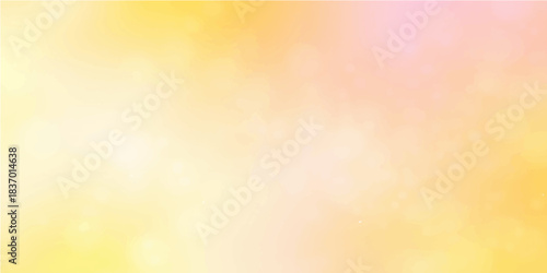 A vibrant abstract background featuring glowing yellow and orange bokeh light patterns with a festive glitter shine for a soft holiday design or wallpaper