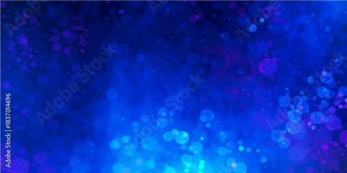 Shiny abstract blue background with bubbles featuring a bokeh pattern of bright winter snow and sparkling Christmas star lights for a festive holiday night backdrop celebration