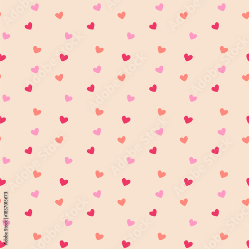 Flat vector seamless pattern of cascading small pink and red hearts on blush pink background. Romantic Valentine's raining hearts motif perfect for wrapping paper, textiles, wallpapers, invitations.