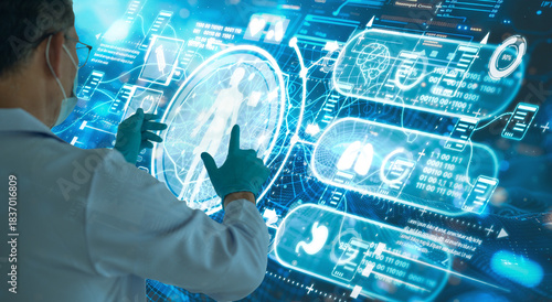 Doctor or surgeon uses a futuristic glowing holographic interface to analyze patient data, representing AI diagnostics, telehealth, big data, and high-tech medical innovation in a dark blue environmen