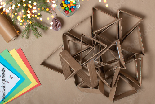 The triangles of the Advent calendar are made of thick cardboard. Step-by-step instructions. Step 4 make a lot of triangles