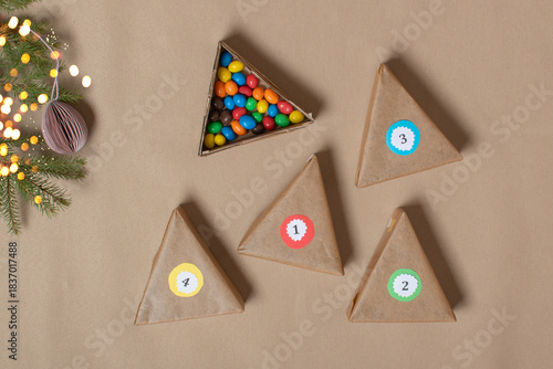 The triangles of the Advent calendar are made of thick cardboard. Step-by-step instructions. Step 7 Put the treats down