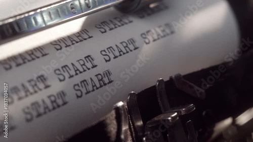 A lot of words Start appears on retro vintage typewriter. Many Start signs appear on old typewriter with cinematic lighting. Close up.