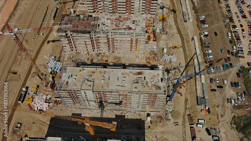 Industrial construction site with construction equipment and materials