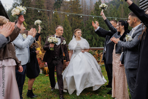 Canvas Print Couple celebrates their wedding with joyful guests in a scenic outdoor setting