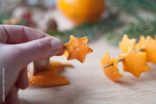 Orange peel idea for festive zero-waste decorations - ornaments ready to decorate a Christmas tree. Reuse citrus scraps for seasonal decor.
