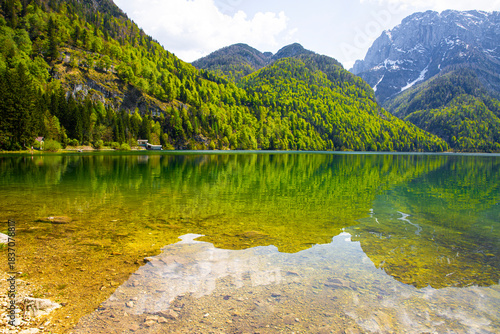 A magnificent landscape of Lake Del Predil (lago Del Predil) in Italy. Beautiful alpine lake, surrounded by Julian Alps. 