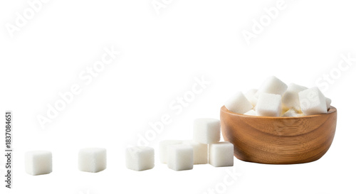 transparent sugar cubes with crystalline texture, some in a light brown wooden bowl, others scattered on a bright white seamless background, high-key studio light. Concept of purity and meticulousness