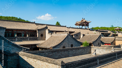 Impressive view of traditional chinese tiled roofs at the historic Wang Family Courtyard near Pingyao, Shanxi Province, China 