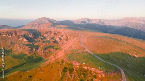 Aerial view of the trans alpine road in Romania. Drone photography of the spectacular Transalpina road crossing the mountains. Photography was shoot from a drone at high altitude, from above the road.