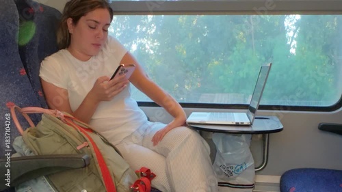 A Quiet Moment of Digital Connection During a Train Trip