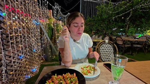 Woman in Deep Thought While Sitting at a Cafe at Night