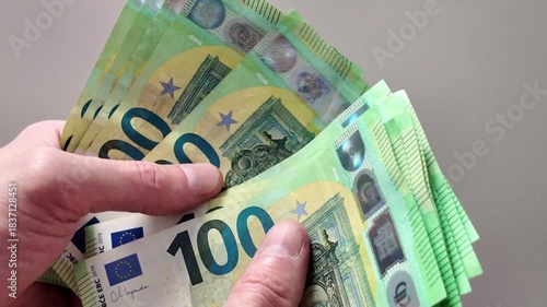Close-up of counting new one hundred euro banknotes