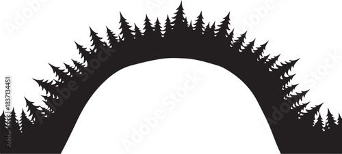 Silhouette of an archway formed by pine trees forest