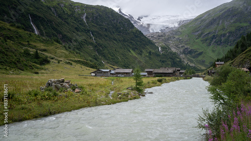 Wallpaper Mural Alpine village scenery with glacial river flowing through and massive glacier above, Austrian Alps Torontodigital.ca