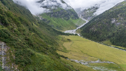 Wallpaper Mural Aerial view on alpine valley with glacier river streaming between the mountains, Austrian Alps Torontodigital.ca