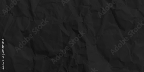 Black crumpled paper texture background. Abstract craft wrinkled kraft decorative pattern design. top view.