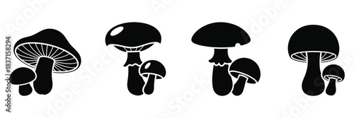 Vector silhouette of set of four black and white mushroom icons in various shapes