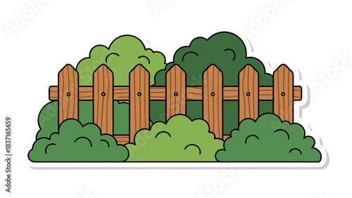 Rustic Wooden Fence Bordering Lush Green Bushes and Foliage in a Garden Setting